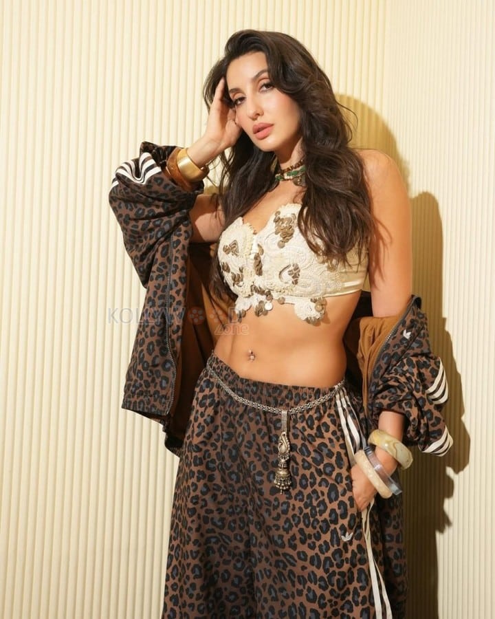 Stylish Nora Fatehi in a White Bralette and Animal Printed Pants Photos 03