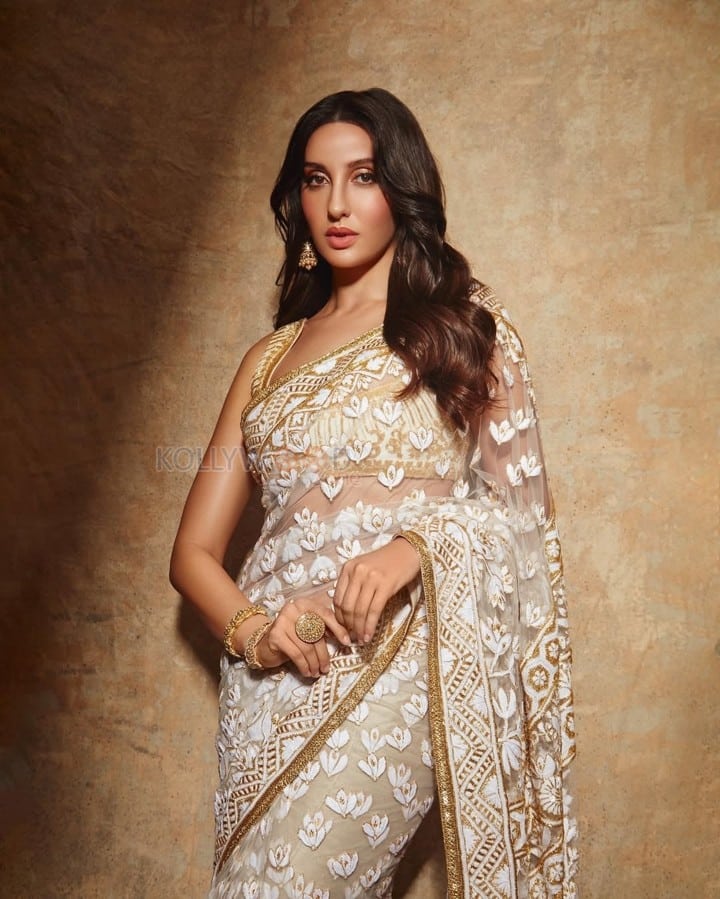 Stylish Nora Fatehi in an Embroidered White Sheer Saree with Matching Blouse Pictures 03