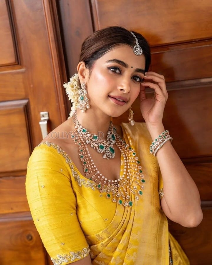 Stylish Pooja Hegde in an Ethnic Bridal Yellow Saree Photos 03