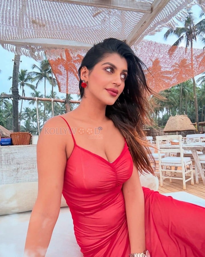 Tamil Beauty Yashika Aannand in a Red Open Back Midi Dress Pictures 01