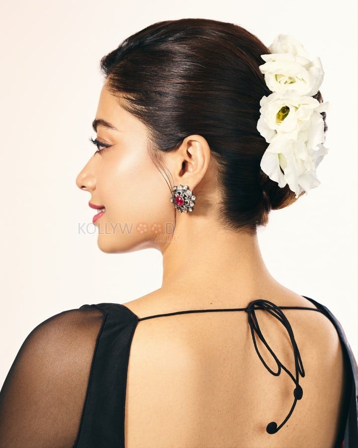 Thamma Actress Rashmika Mandanna in a Black Floral Lehenga with a Sheer Full Sleeve Blouse Pictures 05