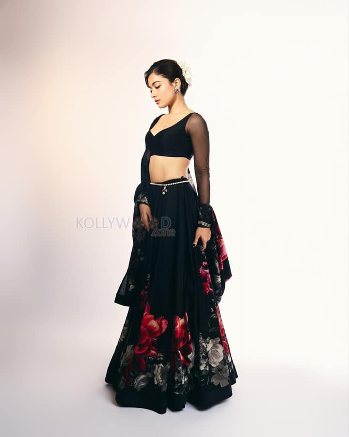 Thamma Actress Rashmika Mandanna in a Black Floral Lehenga with a Sheer Full Sleeve Blouse Pictures 06