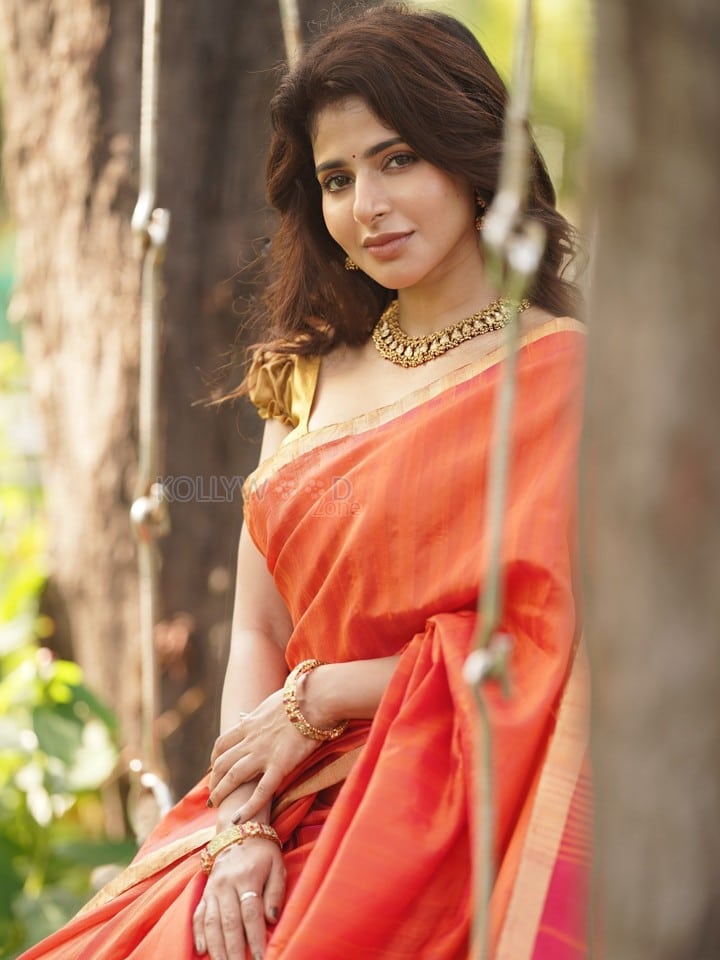 Adorable Iswarya Menon in an Orange Saree with a Golden Puff Blouse Photos 03