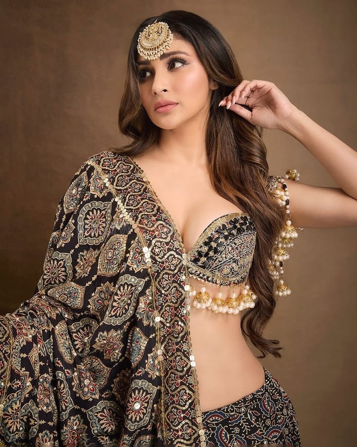 Dazzling Mouni Roy in a Black and Gold Lehenga Choli Photos 03