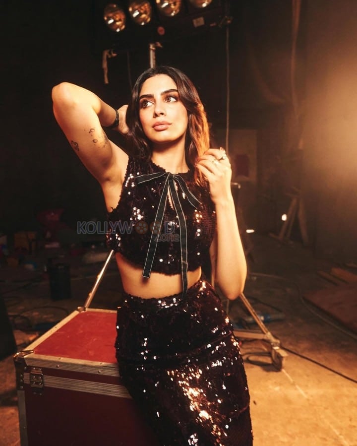 Glamourous Khushi Kapoor in a Shiny Black Crop Top and Skirt Pictures 01