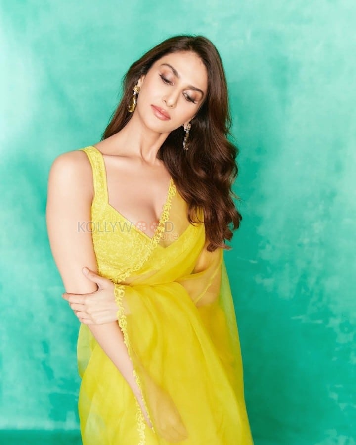 Gorgeous Vaani Kapoor in a Yellow Saree with Deep Neck Cleavage Blouse Photos 01