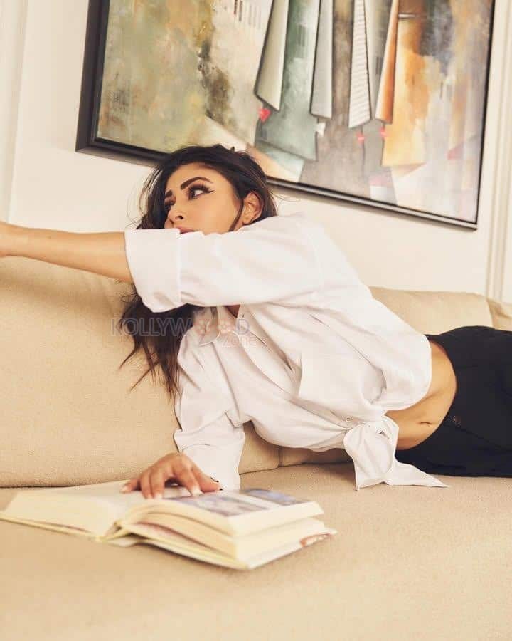 Grace and Glamour Mouni Roy in a Classic Tied Up White Shirt and Black Pants Photos 04