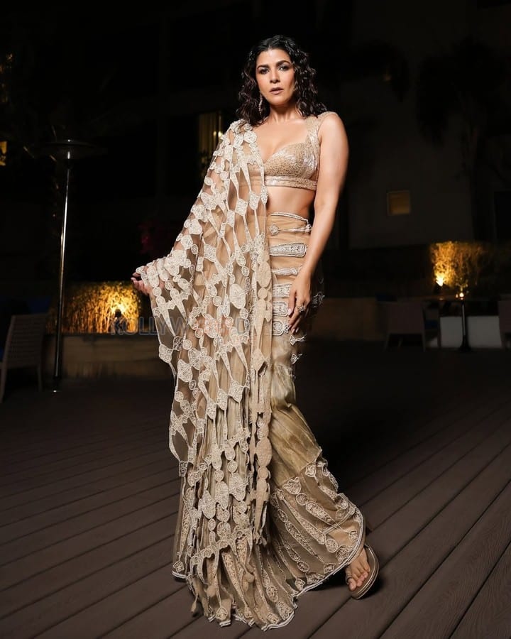 Sexy Nimrat Kaur in a Double Strap Plunging Neckline Blouse with a Transparent Saree at IIFA Digital Awards 2025 Photos 03