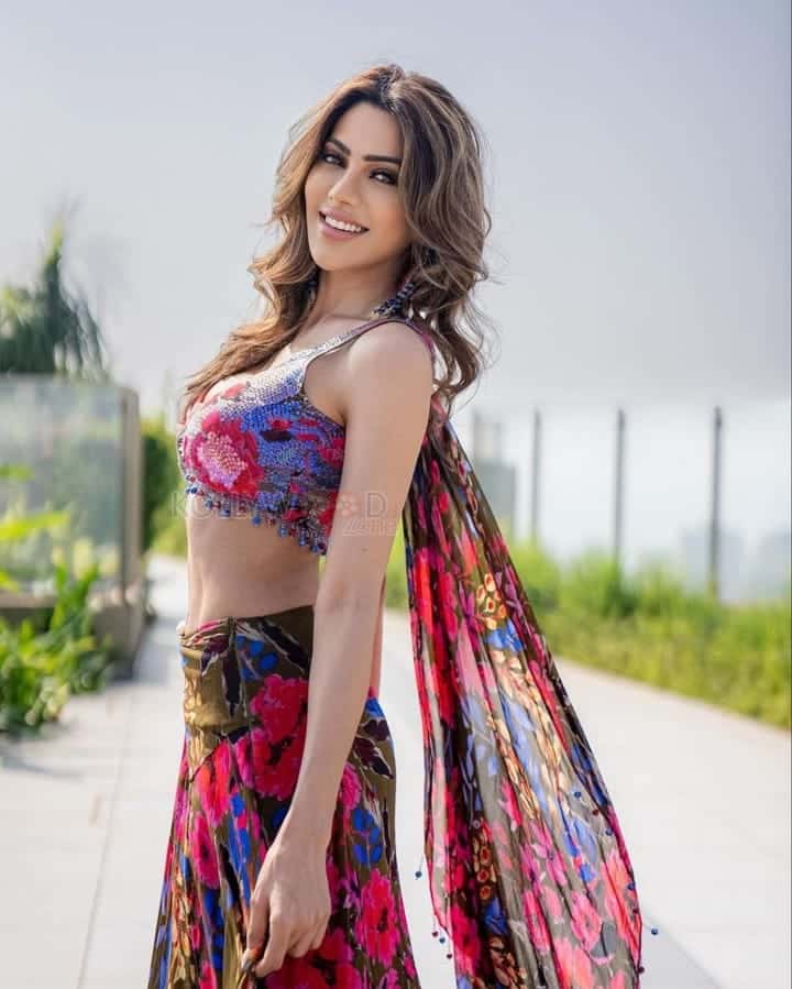 Sizzling Nikki Tamboli in a Multi Colored Draped Skirt Set Photos 02