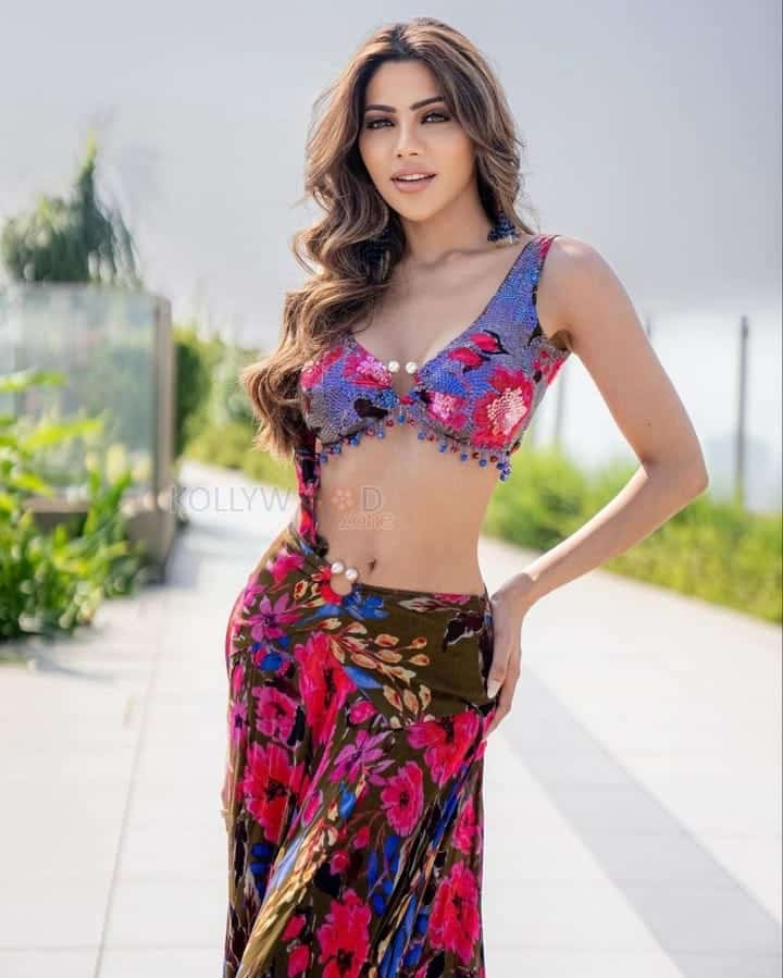 Sizzling Nikki Tamboli in a Multi Colored Draped Skirt Set Photos 04