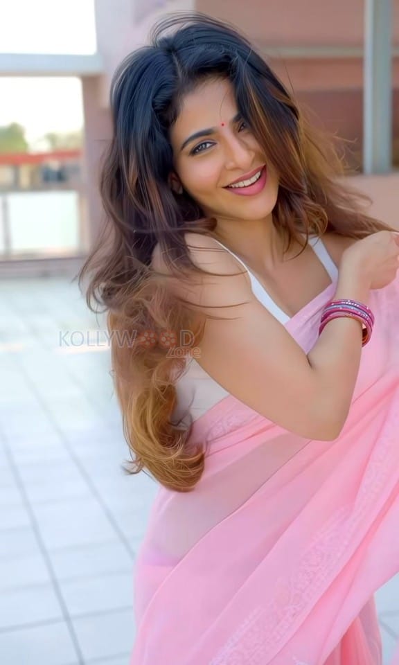 Stunning Iswarya Menon in a Pink Saree with a White Sleeveless Blouse Photos 02