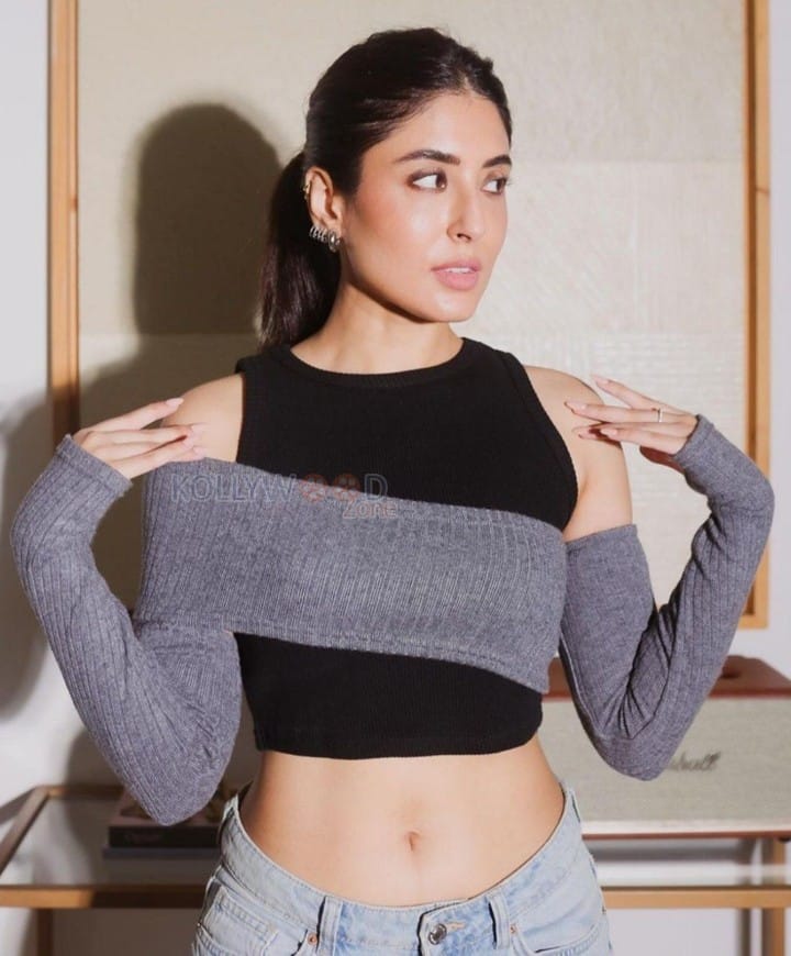 Actress Kritika Kamra in a Black Crop Top with a Grey Knitted Overlay Photos 01