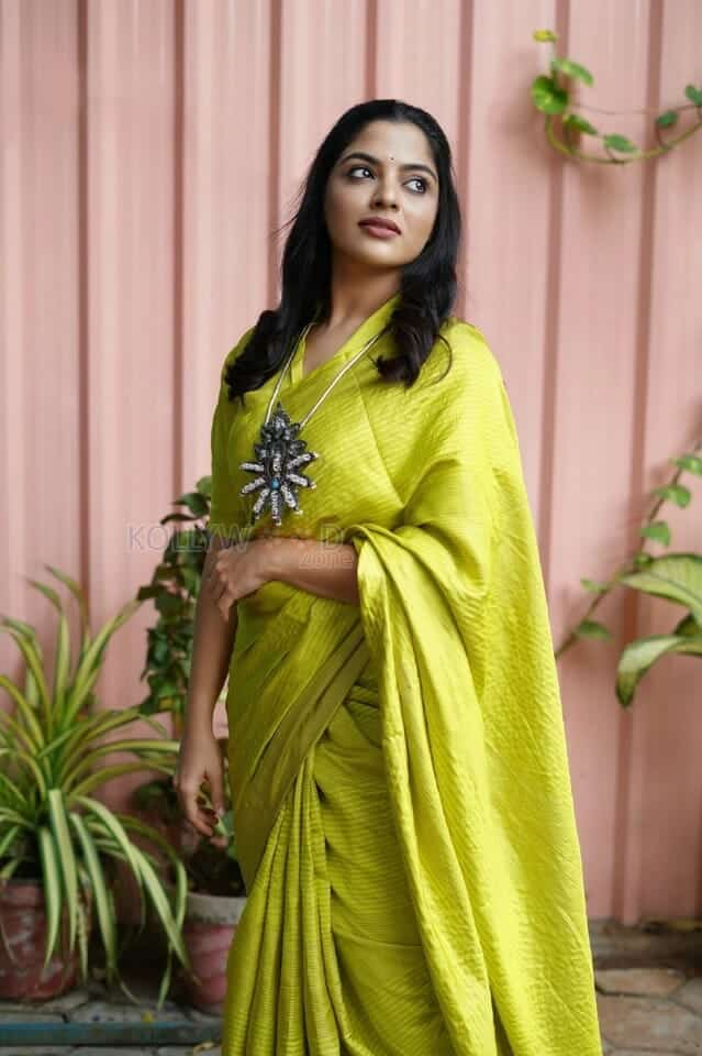 Actress Nikhila Vimal in a Georgette Lime Green Woven Design Saree Photos 01