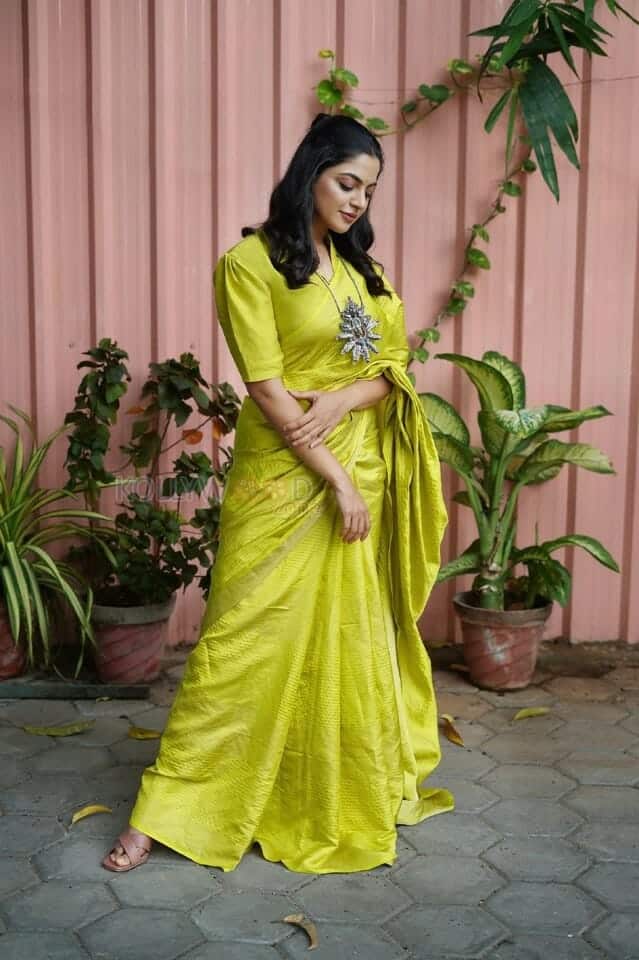 Actress Nikhila Vimal in a Georgette Lime Green Woven Design Saree Photos 02