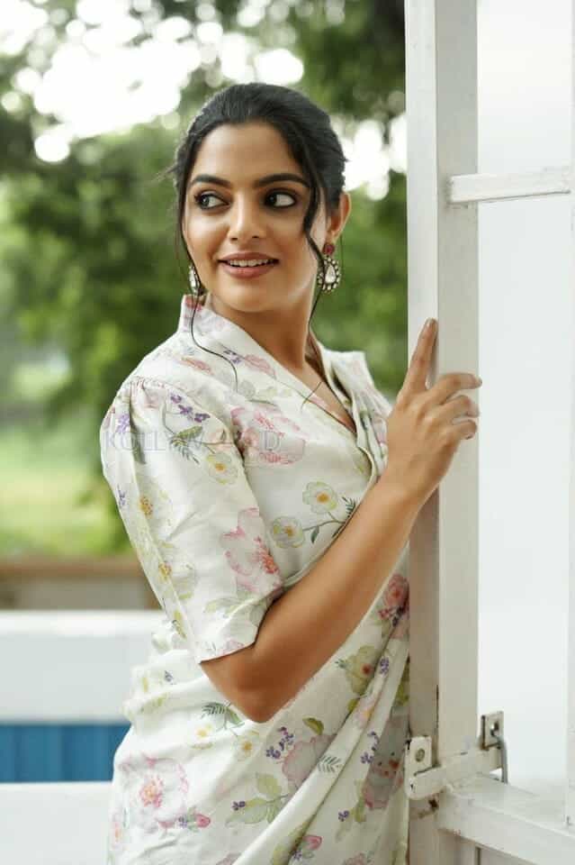 Actress Nikhila Vimal in a White Floral Dress Photos 02