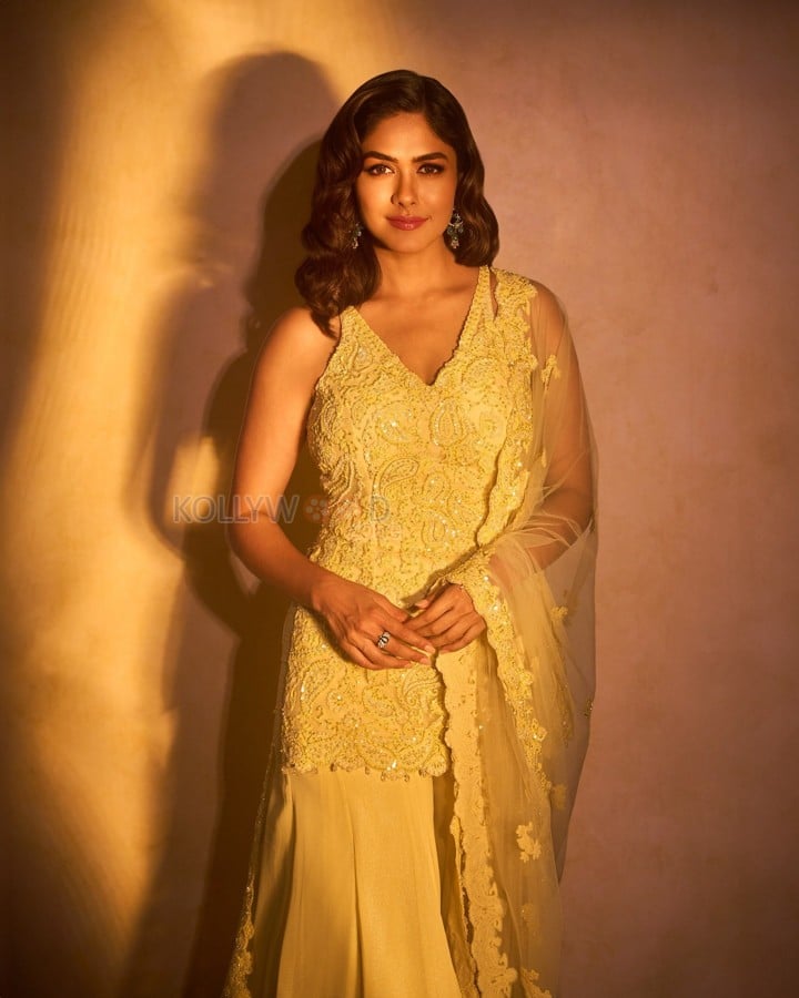 Beautiful Mrunal Thakur in a Yellow Sleeveless Sharara Set Photos 07