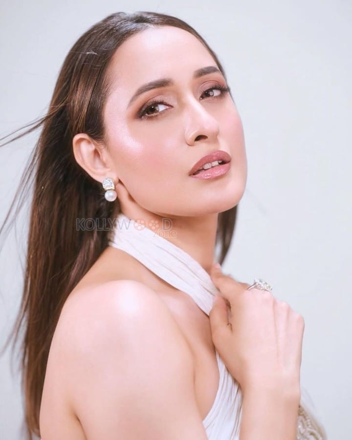 Beautiful Pragya Jaiswal in a White Corset Style Dress Photos 02