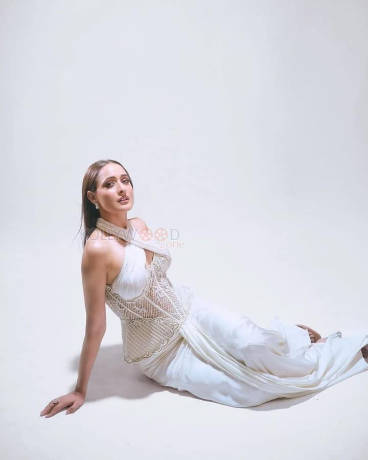 Beautiful Pragya Jaiswal in a White Corset Style Dress Photos 03