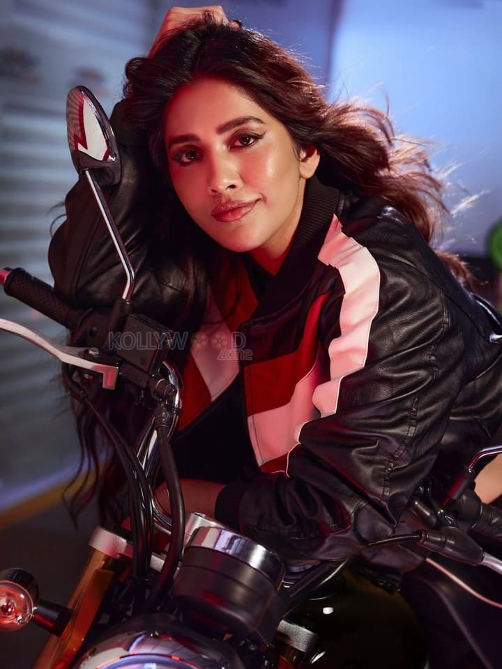 Biker Beauty Nabha Natesh in a Stylish Black Red and White Leather Jacket with a Black Sports Bra and Black Pant Photos 02