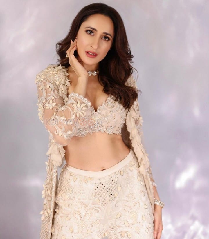 Captivating Pragya Jaiswal in a White Floral Net Blouse with a White Choukar Photos 04
