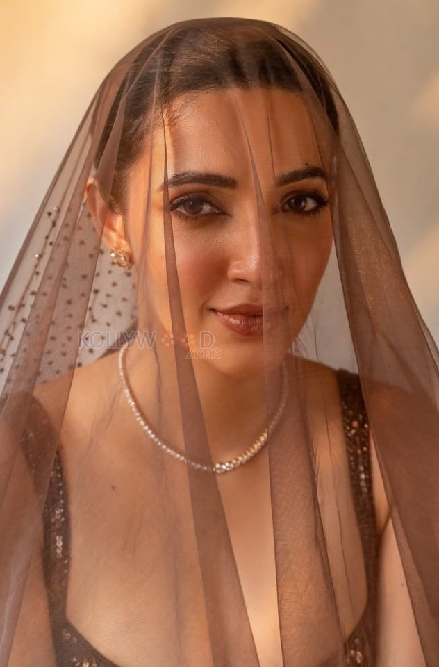 Charming Beauty Neha Shetty in a Golden Lehenga with Sleeveless Blouse Photos 01