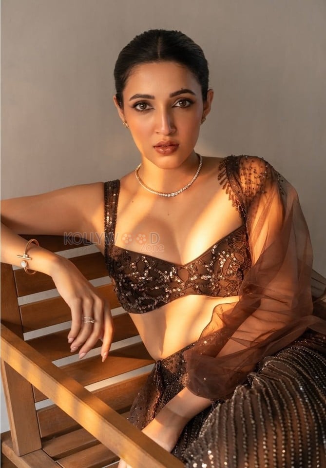 Charming Beauty Neha Shetty in a Golden Lehenga with Sleeveless Blouse Photos 03