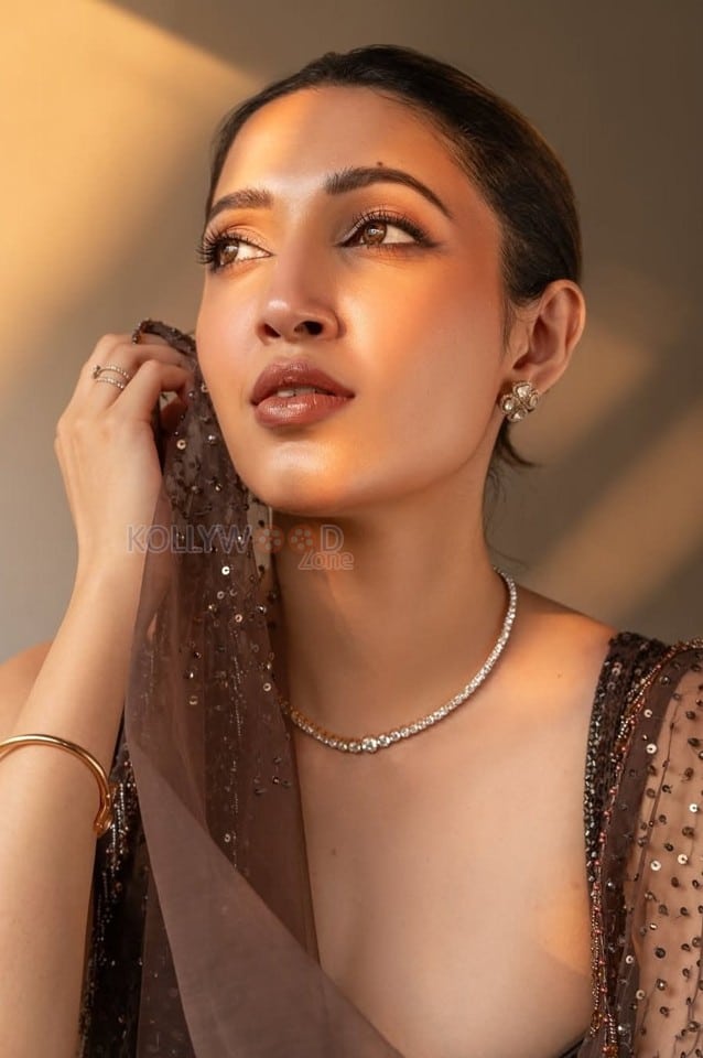 Charming Beauty Neha Shetty in a Golden Lehenga with Sleeveless Blouse Photos 04