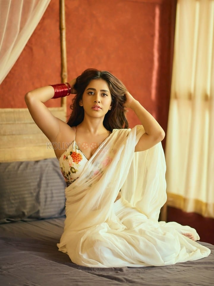 Charming Glamour Nabha Natesh in a White Saree with a Backless Floral Blouse Pictures 01