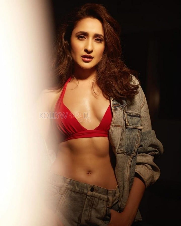 Gorgeous Pragya Jaiswal in a Trendy Denim Jacket and Red Bra Photos 04