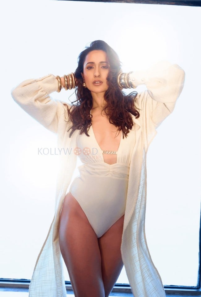 Graceful and Charming Pragya Jaiswal in a White One Piece Swimsuit Bikini Pictures 04