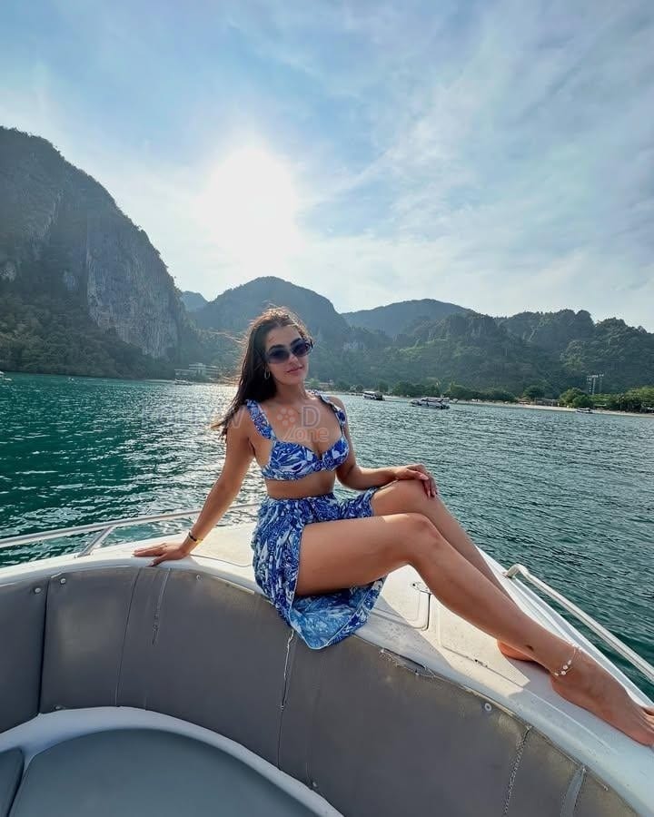 Hot Kavya Thapar in a Blue Floral Beach Bikini Photos 04