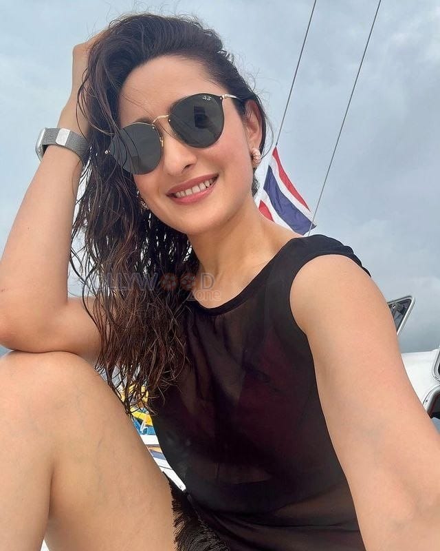 Pragya Jaiswal in a Black Sleeveless See Through Mini Cutout Dress Pictures 01