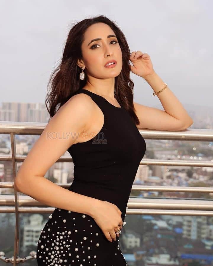 Sexy Pragya Jaiswal in a Black Sleeveless Dress with Pearl Stitched Skirt Pictures 01