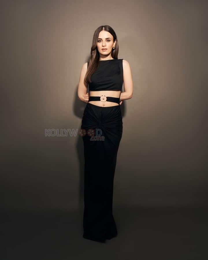 Sexy Radhika Madan in a Black Cold Shoulder Maxi Dress Photos 04