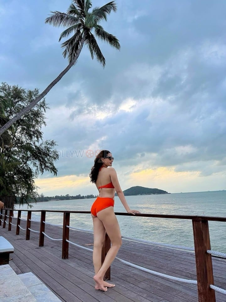 Tempting Hot Pragya Jaiswal in an Orange One Piece Swimsuit Bikini Photos 01