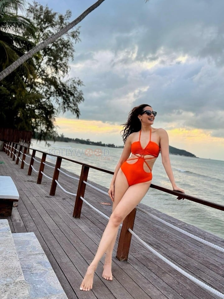 Tempting Hot Pragya Jaiswal in an Orange One Piece Swimsuit Bikini Photos 02