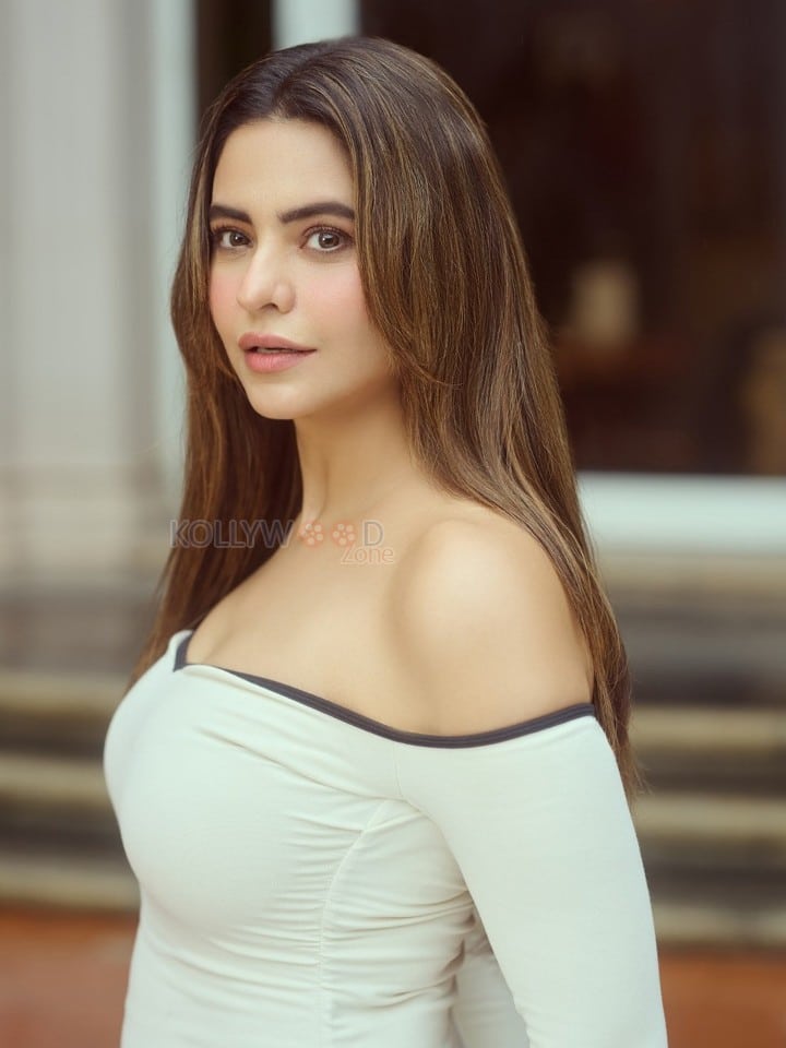 Graceful Aamna Sharif in a White Off Shoulder Mini Dress Photos 02