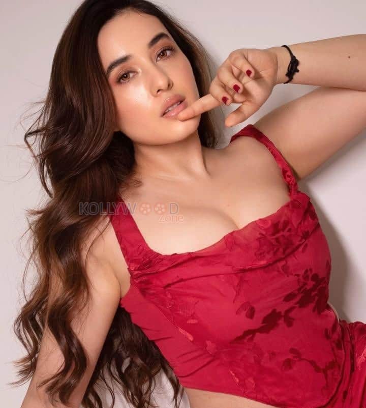 Nepali Actress Aditi Budhathoki Cleavage in a Red Sleeveless Bodycon Dress Pictures 04