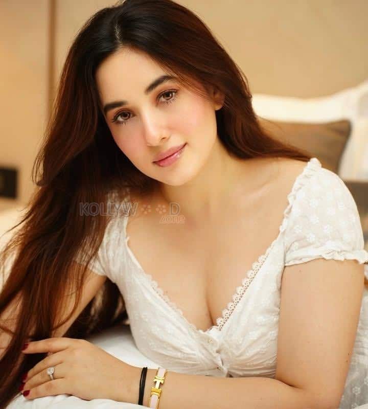 Stunning Aditi Budhathoki Cleavage in a Lace White Dress Photos 01