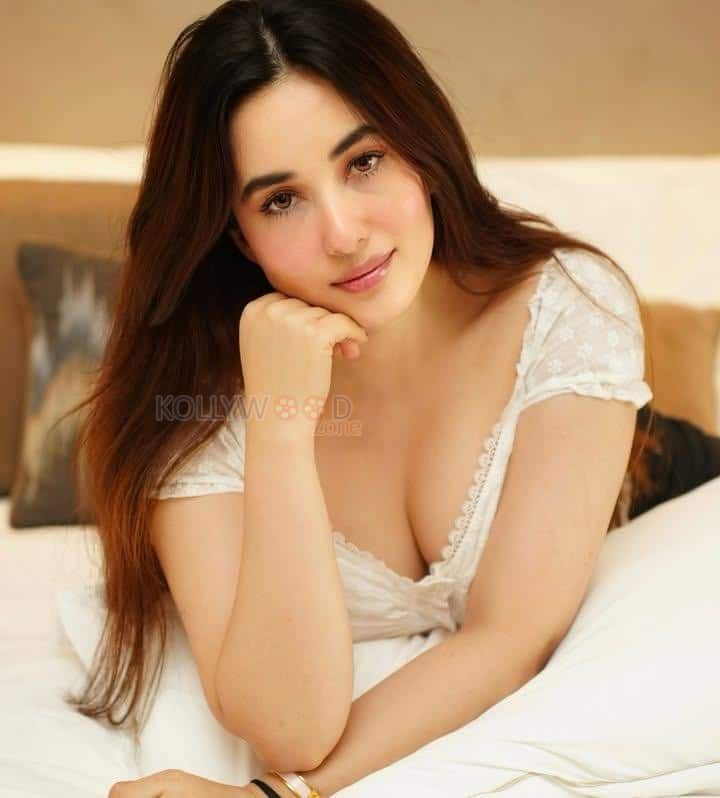 Stunning Aditi Budhathoki Cleavage in a Lace White Dress Photos 04