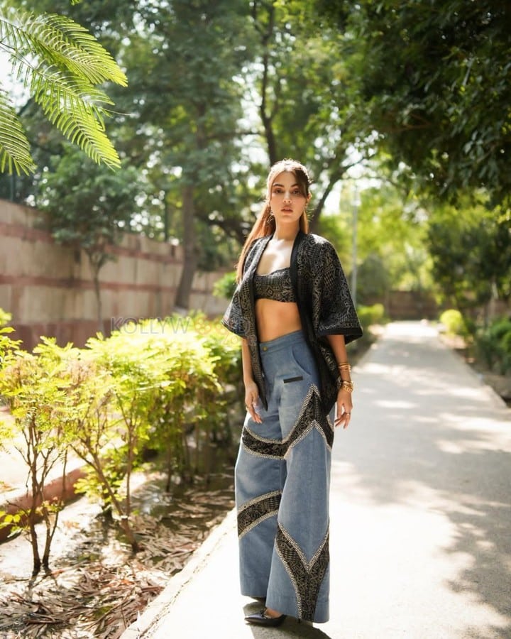 Stylish Rhea Chakraborty in a Printed Black Bralette with a Stylish Black Jacket and Blue Jeans Photos 02