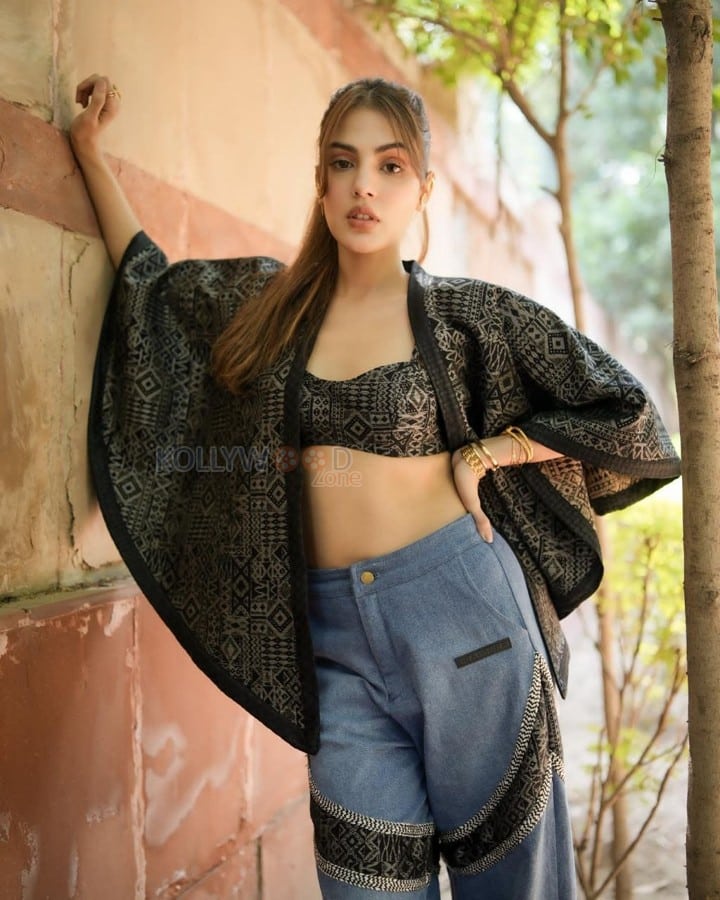 Stylish Rhea Chakraborty in a Printed Black Bralette with a Stylish Black Jacket and Blue Jeans Photos 04