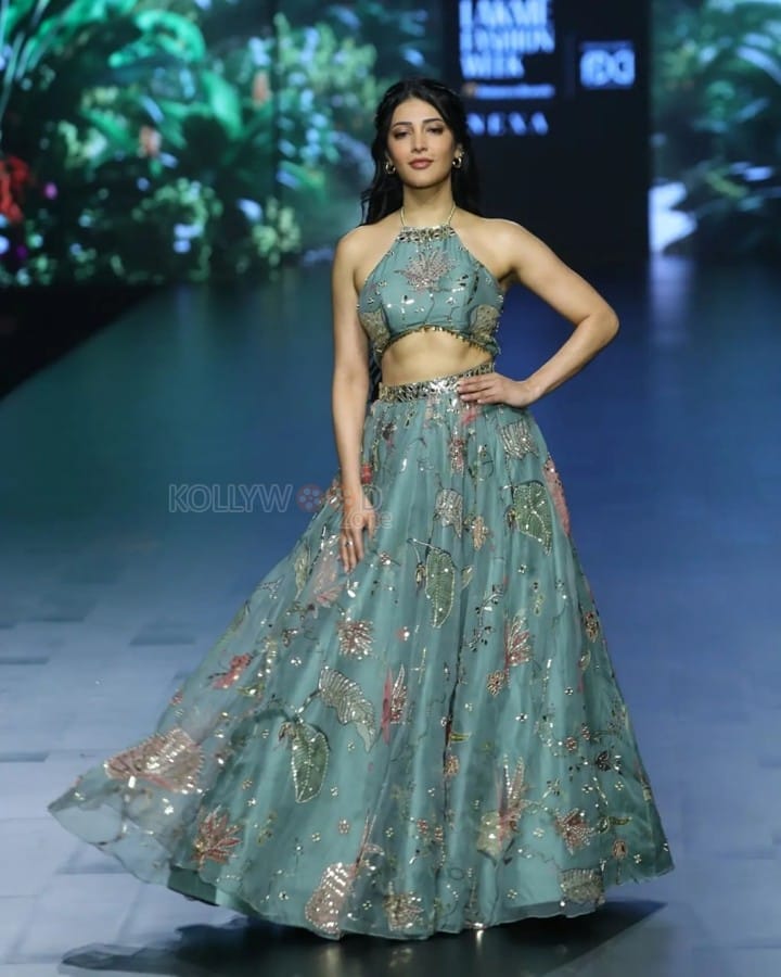 Stylish Shruti Haasan in a Cyan Colored Halter Neck Crop Top with a Matching Floral Skirt Pictures 02