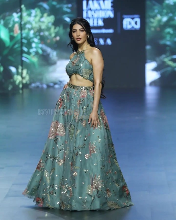 Stylish Shruti Haasan in a Cyan Colored Halter Neck Crop Top with a Matching Floral Skirt Pictures 03