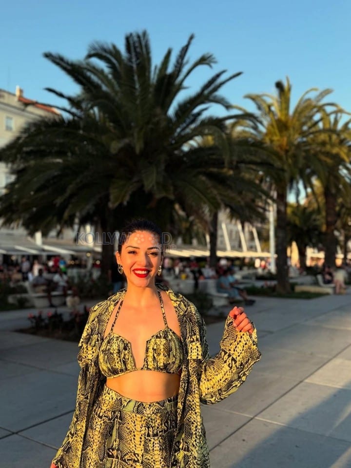 Bold Mehreen Pirzada in a Yellow and Black Halter Top and Shorts with a Loose Skirt Pictures 01