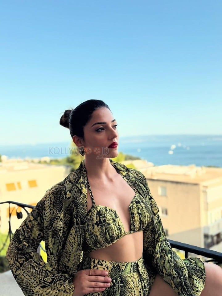 Bold Mehreen Pirzada in a Yellow and Black Halter Top and Shorts with a Loose Skirt Pictures 06