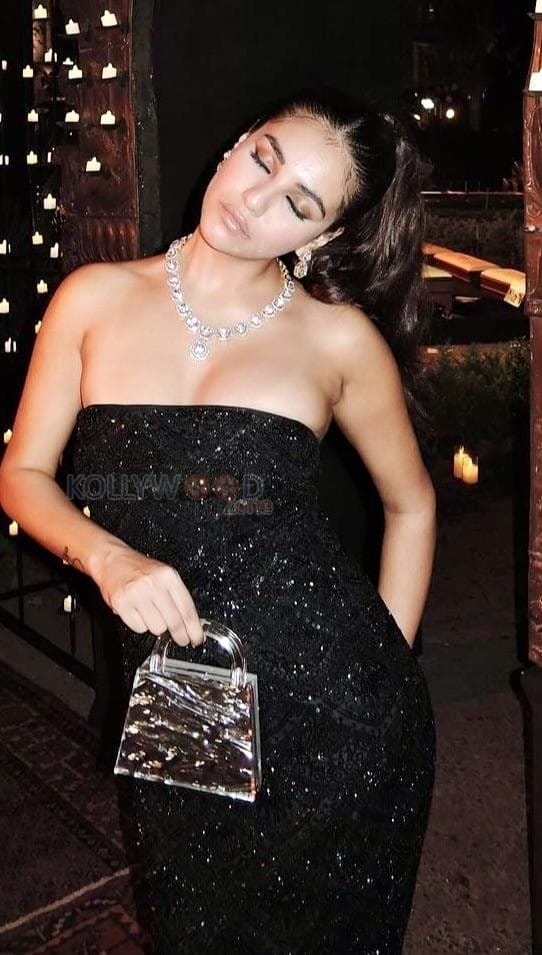 Enchanting Radhika Seth in a Black Glimmering Bodycon Dress Photos 05