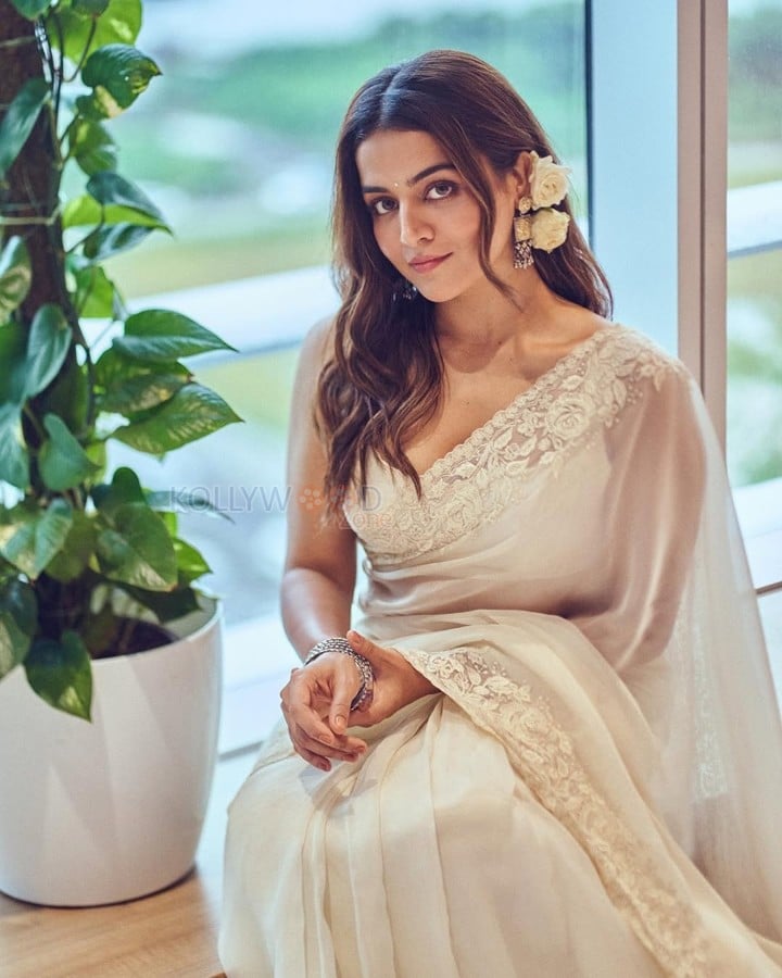 Graceful Wamiqa Gabbi in a White Chikankari Embroidered Saree Floral Border with Matching Sleeveless White Blouse 01
