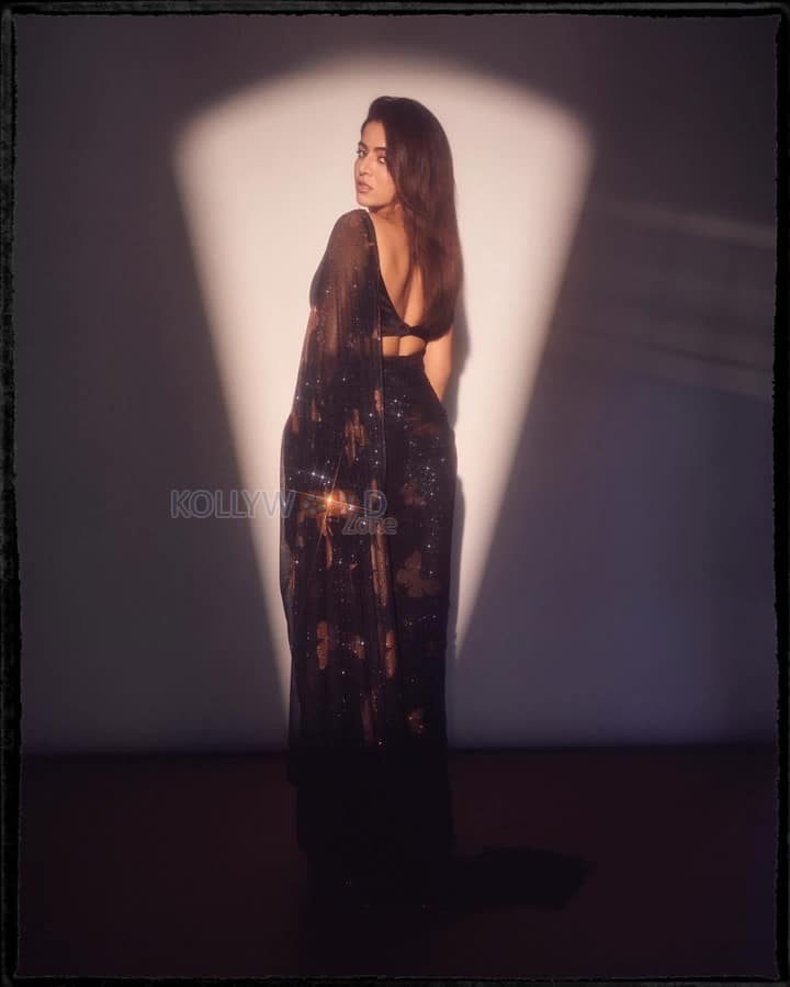 Mesmerizing Wamiqa Gabbi in a Black Butterfly Sheer Saree with a Black Sleeveless Blouse Pictures 05
