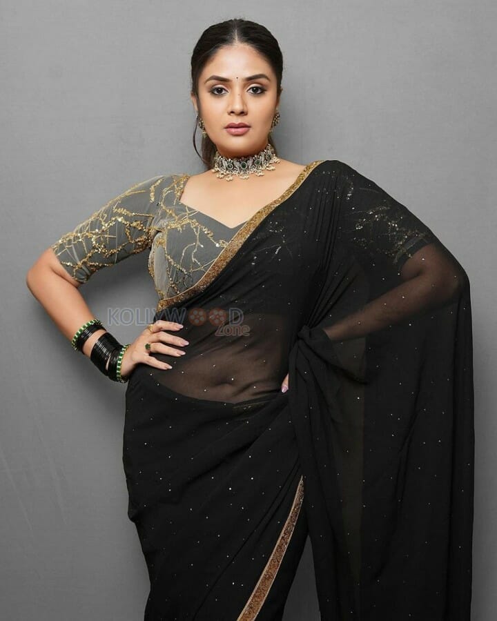 Sexy Sreemukhi in a Black Transparent Saree Photos 03